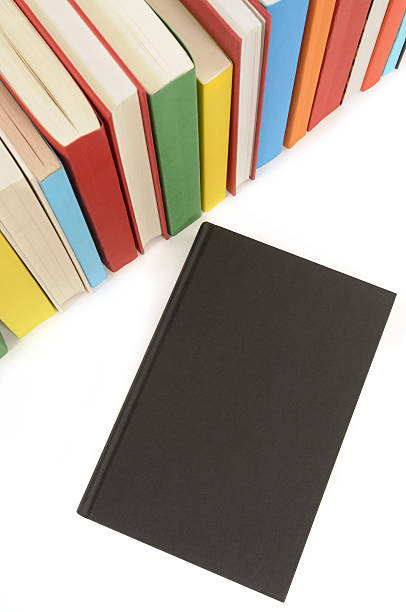 Plain black book with row of colorful books  handbook book hardcover book red stock pictures, royalty-free photos & images