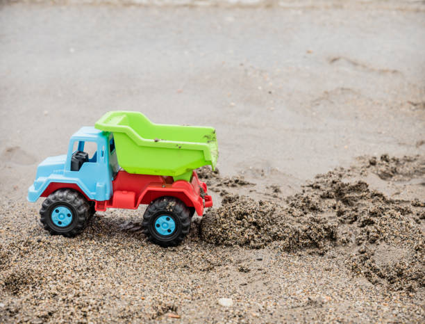 istock toys in the sand at the beach 969845042