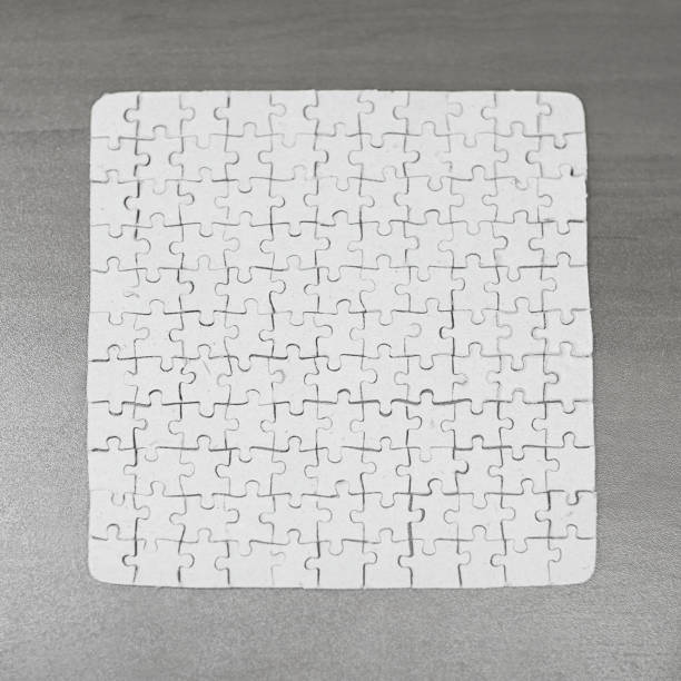 istock close up. blank card collected from puzzle pieces on gray backgr 969845082