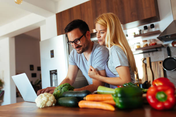 istock Young couple in love in the kitchen 969846018