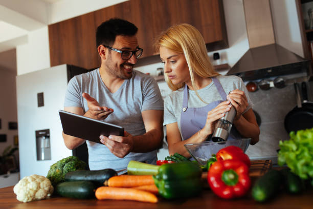 istock Young couple in love in the kitchen 969848216