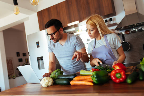 istock Young couple in love in the kitchen 969848470