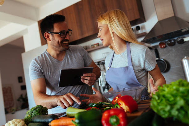 istock Young couple in love in the kitchen 969850786