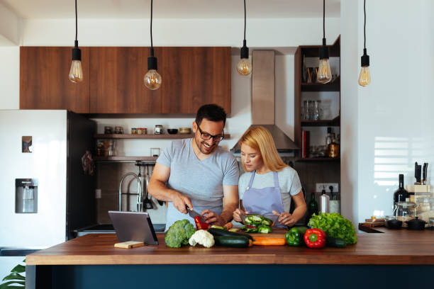 istock Young couple in love in the kitchen 969852942