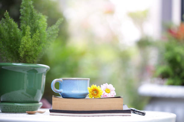 istock Blue vintage cup and flower with notebooks at outdoor 969853356