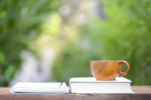 istock Brown vintage cup with books at outdoor 969853372