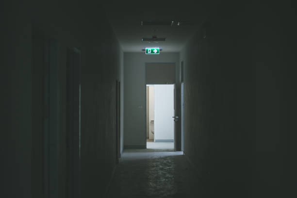 istock Green emergency exit sign showing the way to escape. 969855828