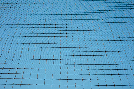 Net with blue sky background.