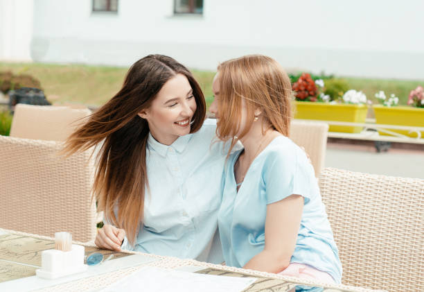 istock girlfriends girls have fun in a cafe 969859944