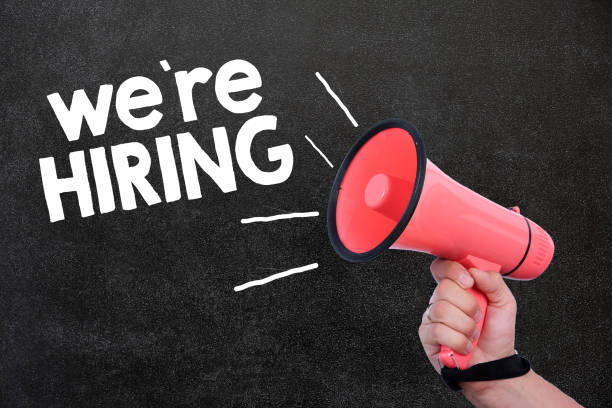istock We are hiring with loudspeaker in the hand 969862502