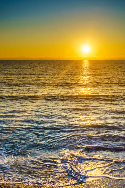 istock Sunset or sunrise over sea surface 969869350