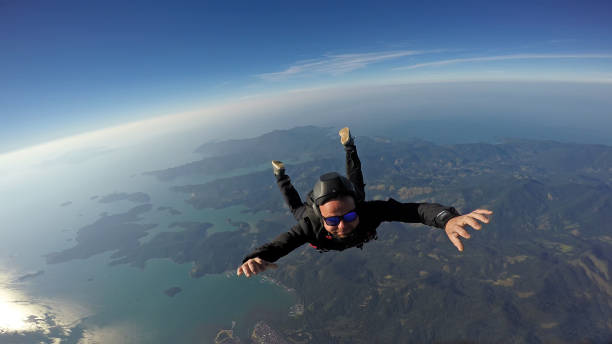 istock Skydiver jump over the sea and mountains 969881298