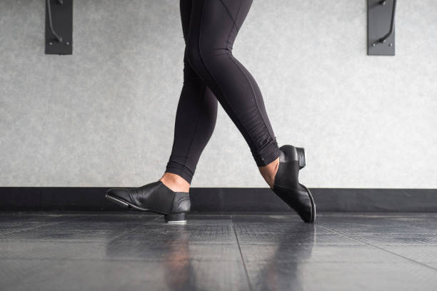Toe Heel stand in tap shoes during dance class Toe Heel stand in tap shoes during dance class in the dance studio tapping stock pictures, royalty-free photos & images