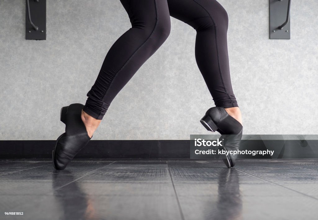 Tap shoe Toe Stand in Tap Class Young dancer in dance learning Toe Stands in tap shoes in Tap Class Tap Dancing Stock Photo