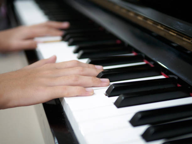 istock Child hand on piano keys 969884932