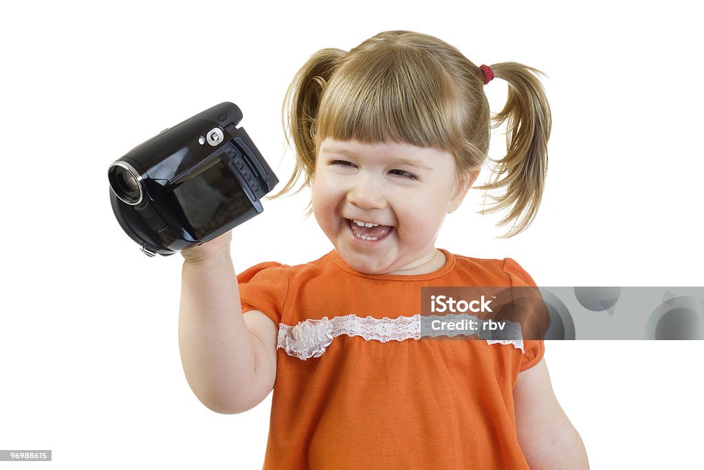 Urocza dziewczynka z camcoder - Zbiór zdjęć royalty-free (Domowa kamera video)