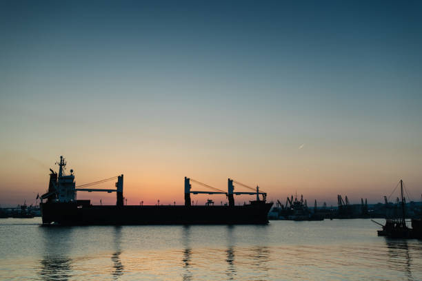 istock Sunset and pier in background with boats 969887254