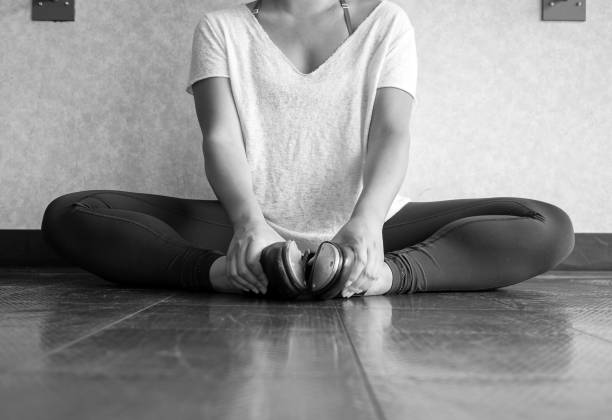 istock Black and white version of Tap dancer stretching before dance class 969887258
