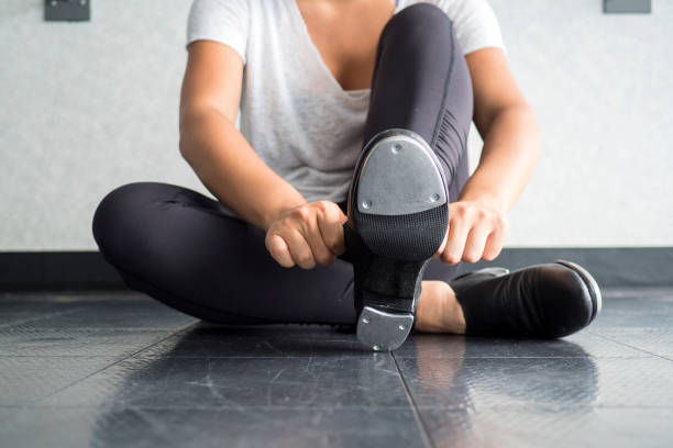 istock Tap dancer sliding on her tap shoes in the dance studio during dance class 969887284