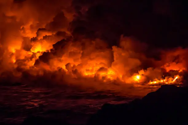 Fire and lava flowing from the volcanic eruption in Hawaii on the Big Island