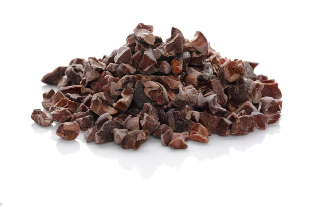 Cacao Nibs cacao nibs isolated on white background cacao nib stock pictures, royalty-free photos & images