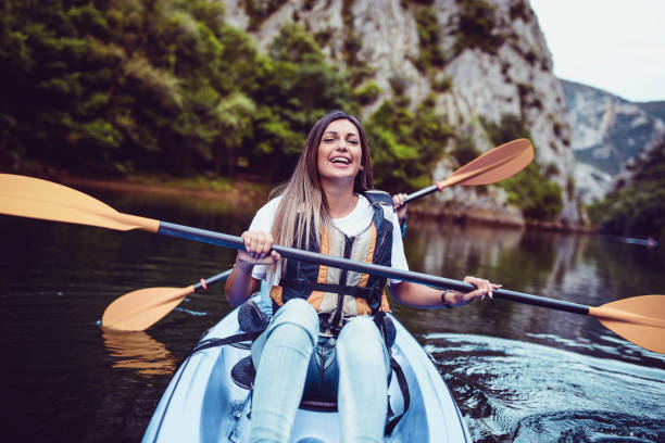 istock Cute Smiling Female On A Kayaking Trip With Brother 969909542
