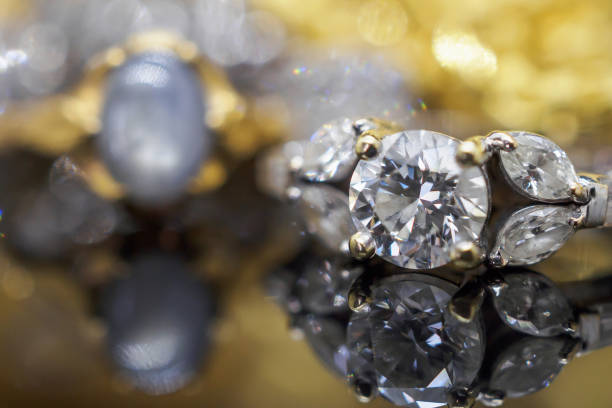 istock Luxury gold Jewelry diamond rings with reflection on black background 969910062