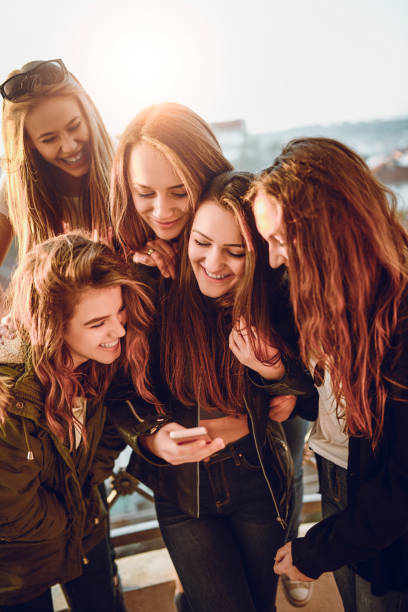 istock Crazy Girls Sending Funny Photo Message 969918200