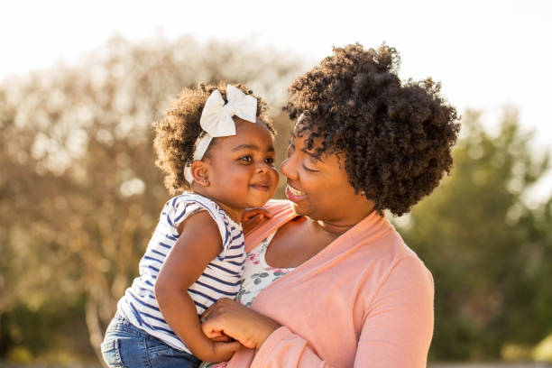 istock African American mother holding her daughter. 969921030