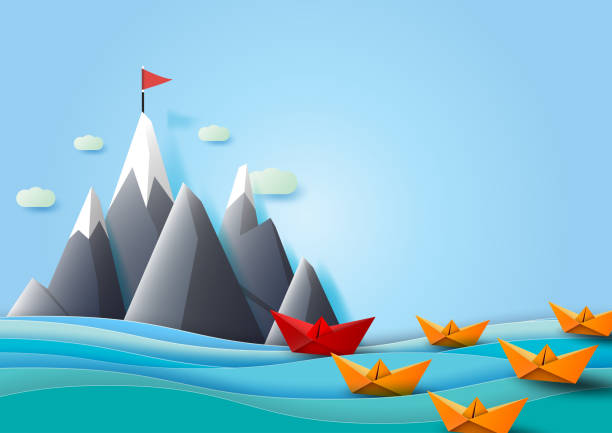 istock Paper boats team sailing to the red flag on the mountain. 969936466
