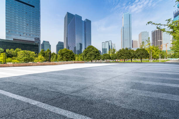 istock modern business office buildings with empty road,empty concrete square floor 969940402