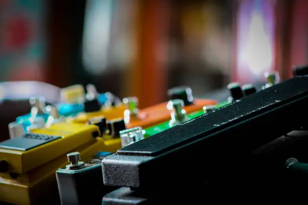 Close up view of a guitar pedal board
