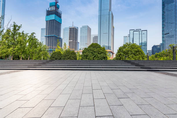 istock modern business office buildings with empty road,empty concrete square floor 969943120