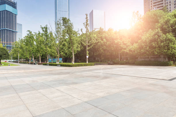 istock modern business office buildings with empty road,empty concrete square floor 969943152
