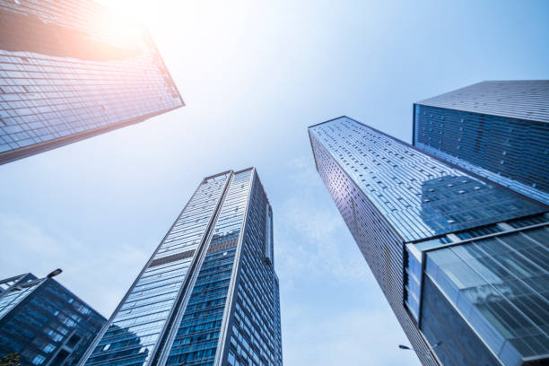 istock modern business office buildings with empty road,empty concrete square floor 969943218