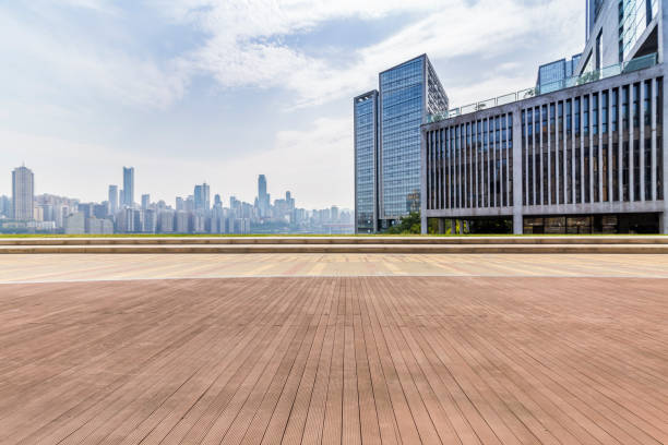 istock modern business office buildings with empty road,empty concrete square floor 969943308