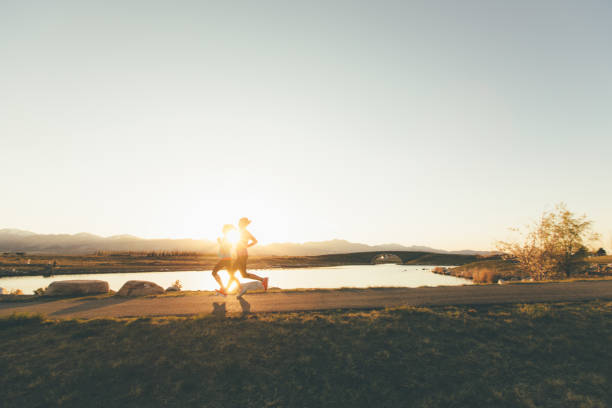 istock Female Runners on a Trail at Sunset 969945980