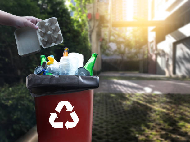 istock man hand putting plastic reuse for recycling concept environmental protection world recycle 969949036