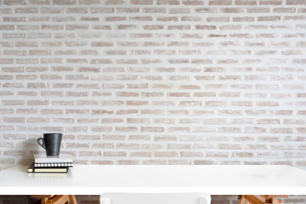 istock Mockup books and coffee mug on white desk. for product display montage 969949178