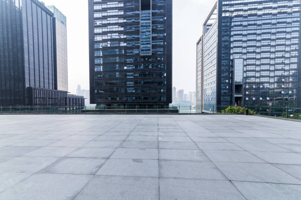 istock Panoramic skyline and modern business office buildings with empty road,empty concrete square floor 969951972