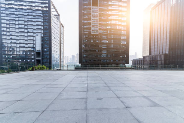 istock Panoramic skyline and modern business office buildings with empty road,empty concrete square floor 969952038