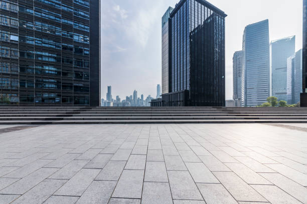 istock Panoramic skyline and modern business office buildings with empty road,empty concrete square floor 969952078