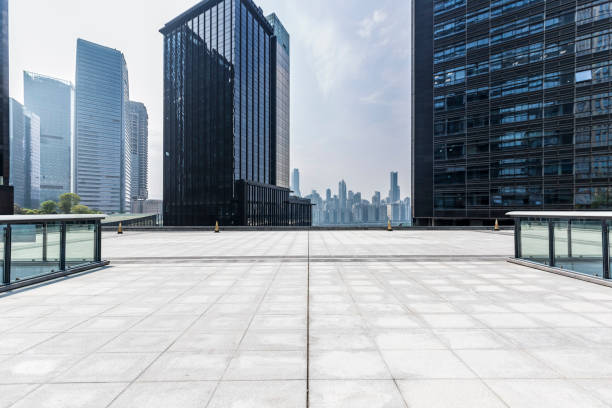 istock Panoramic skyline and modern business office buildings with empty road,empty concrete square floor 969952150