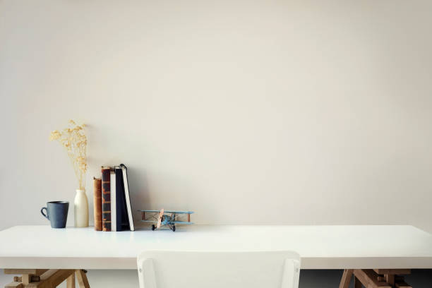 istock Loft workspace desk with books, house plant and copy space 969952526
