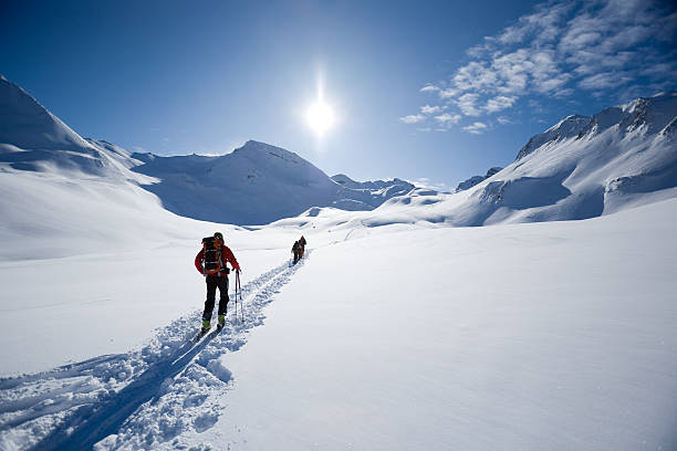 ski mountaineering ski touring, ski mountaineering people on its way in the Austrian/Swiss Alps back country skiing photos stock pictures, royalty-free photos & images