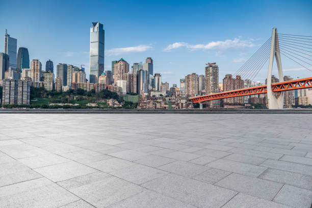 istock modern business office buildings with empty road,empty concrete square floor 969955326