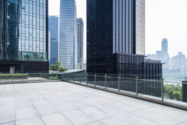 istock Panoramic skyline and modern business office buildings with empty road,empty concrete square floor 969955522