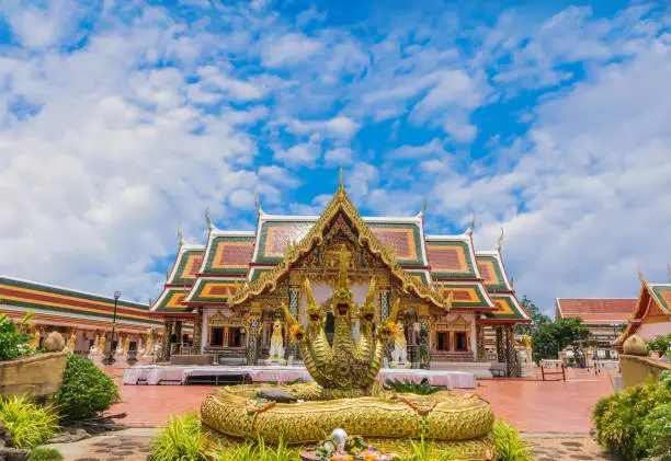 Photo of The sanctuary, temple, with the beautiful sky cloud.The public properties at Wat Phra That Choeng Chum,Sakon Nakhon Province, Thailand.