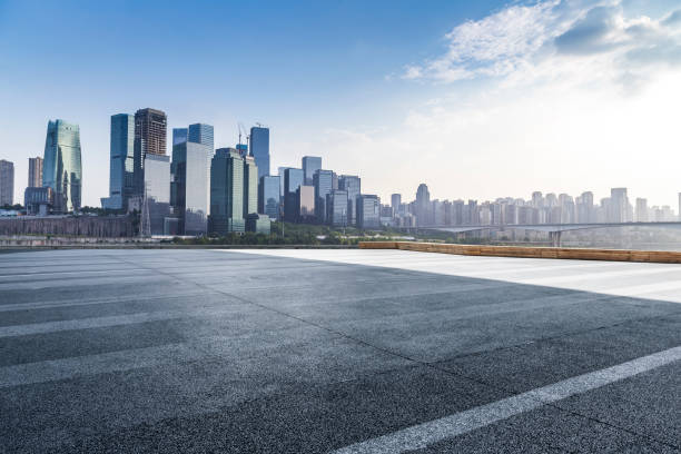 istock Panoramic skyline and modern business office buildings with empty road,empty concrete square floor 969957912