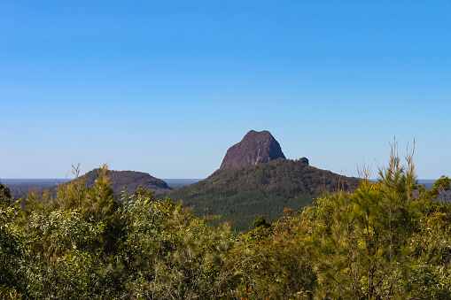 View of the Glass House Mountains in Queensland Australia - lava cores of volcanos that still stand after the surround moutains have eroded away eons ago